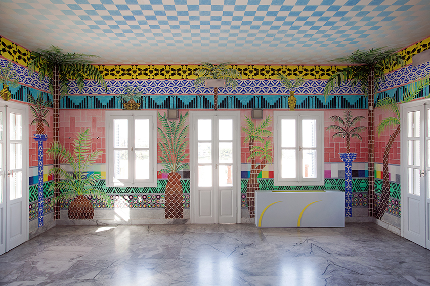 Since arriving in Athens in September 2015, Navine G. Khan-Dossos has heard a curious story, told and retold in different ways. It is about the removal of the palm trees from the urban landscape of Athens as a way of visually ‘re-orientating’ the city towards Europe rather than the ‘Orient’. This urban legend has been told to her three times: once as happening at the end of the Ottoman Empire’s sway over Greece, the second time at the end of the Second World War, and the last at the time of the Junta. She is still trying to work out if any of these different versions are true.

The work is now a permanent installation of the fifth floor of the Benaki Islamic Art Museum in Athens